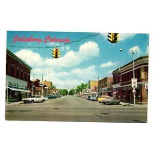 Vintage Julesburg Colorado Main Street Postcard Travel Roadways Cars Stores